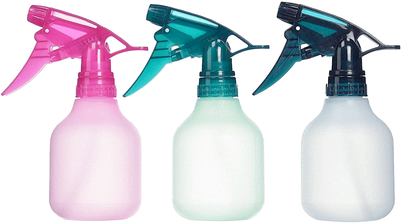 Three plastic Tolco spray bottles in pink, teal, and dark teal colors, with adjustable nozzles for misting or jet spraying, showcased for the Tolco Corporation's cleaning supplies product line.